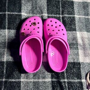 Pink crocs with heart charms
